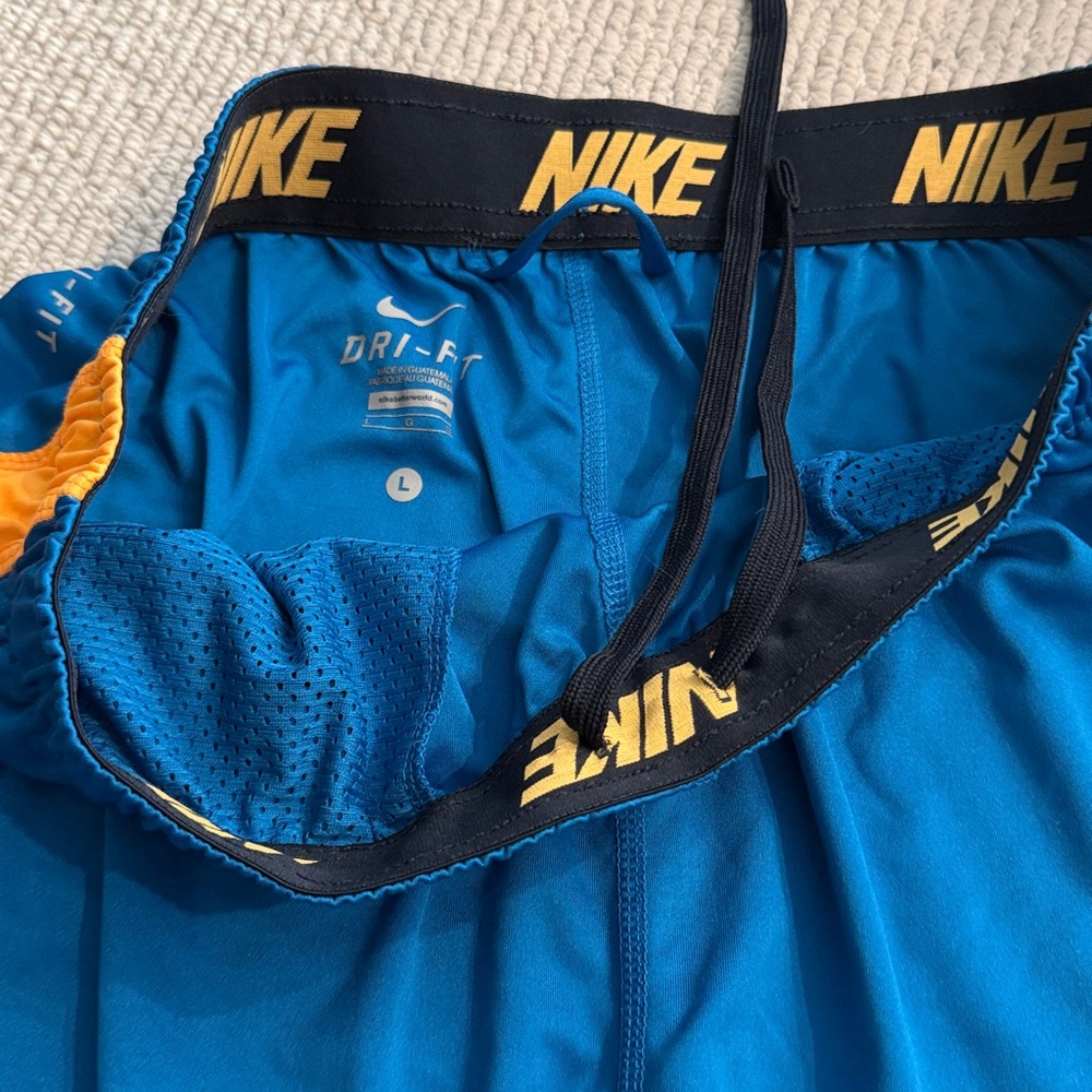 Nike basketball Blue Shorts with Orange Trim - Picture 2 of 3